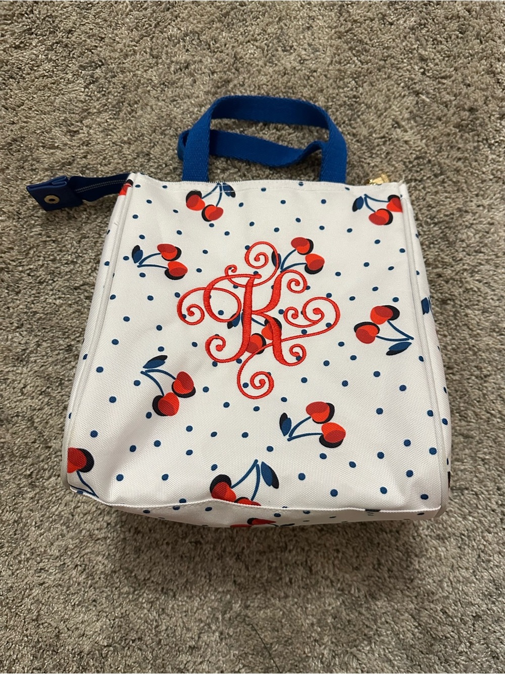 kate spade White Cosmetic Bag with Red Cherry Print and Blue Handles lunch box